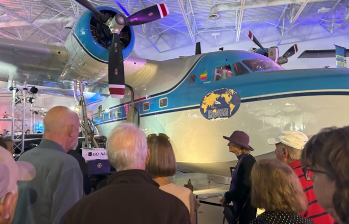 seniors listening to docents at the museum