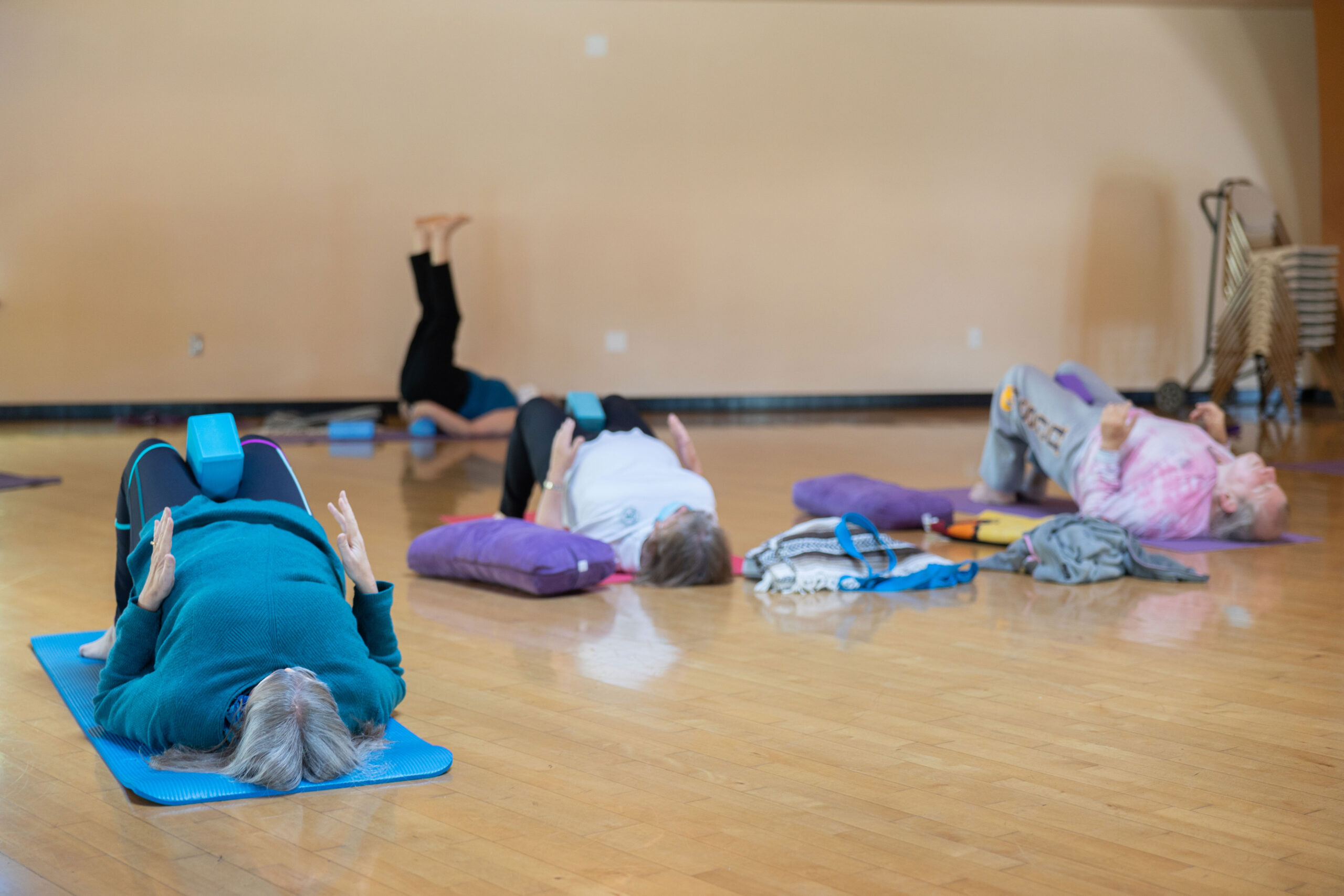 adults doing yoga