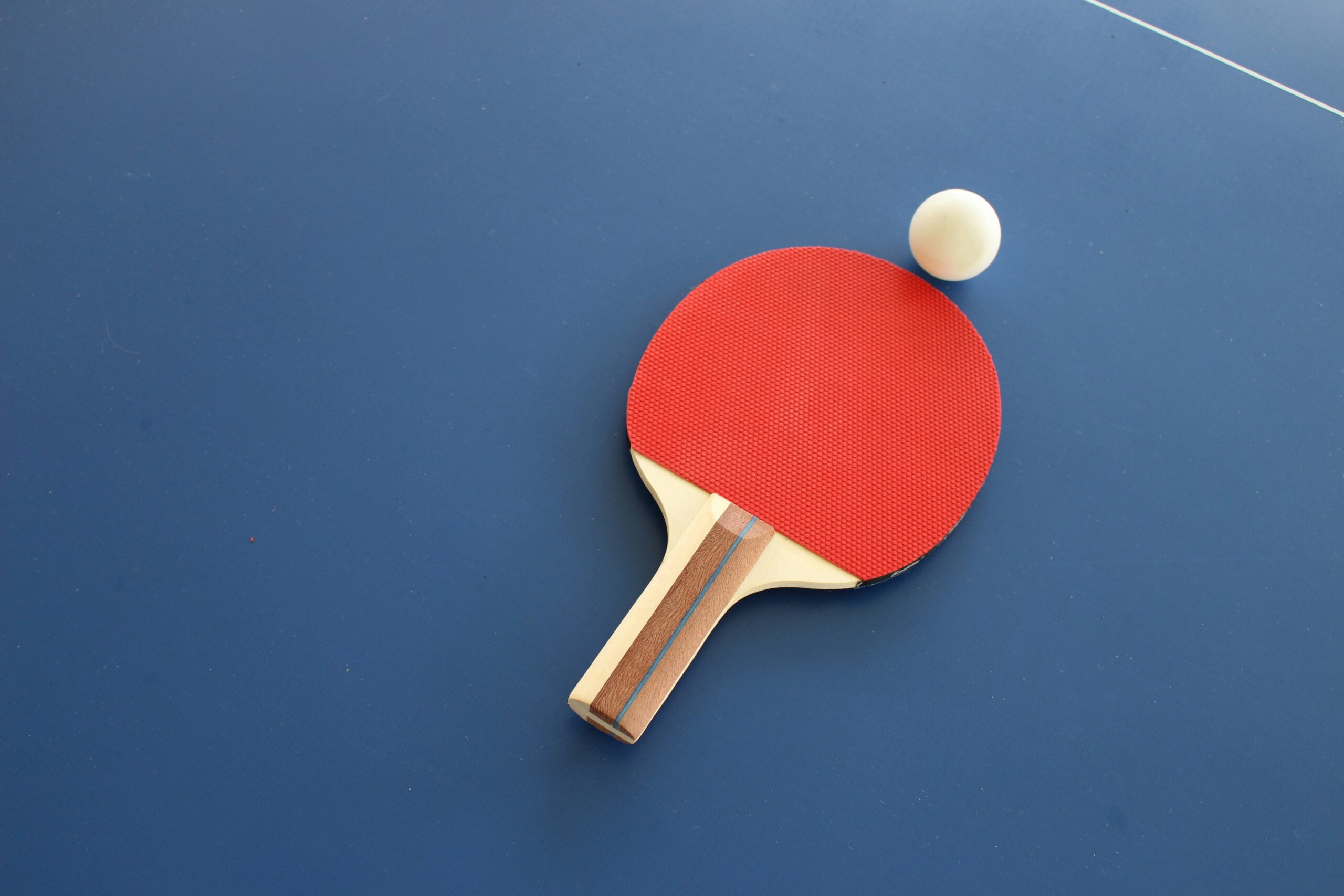 ping pong paddle and ball