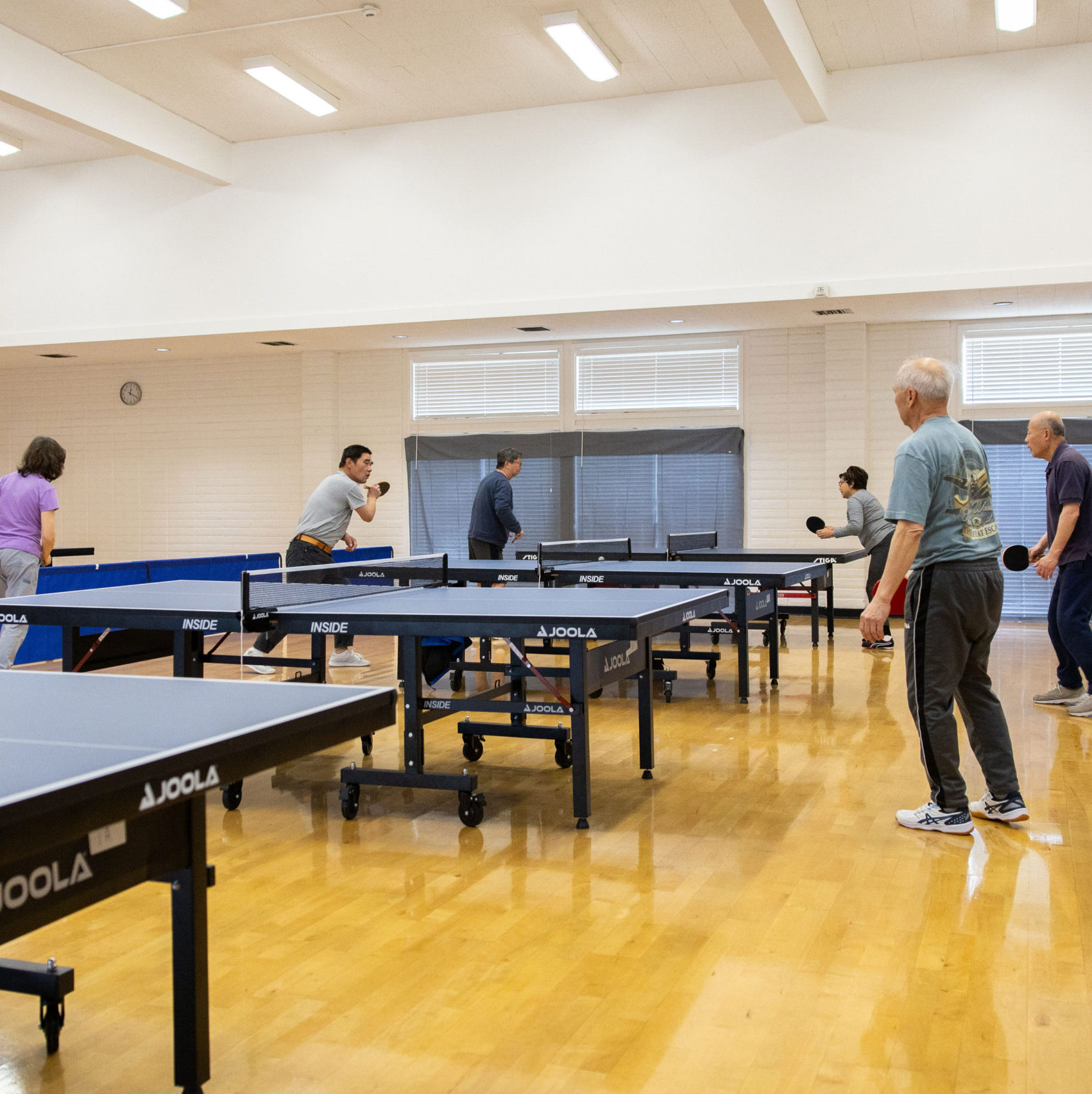 Adults playing table tennis