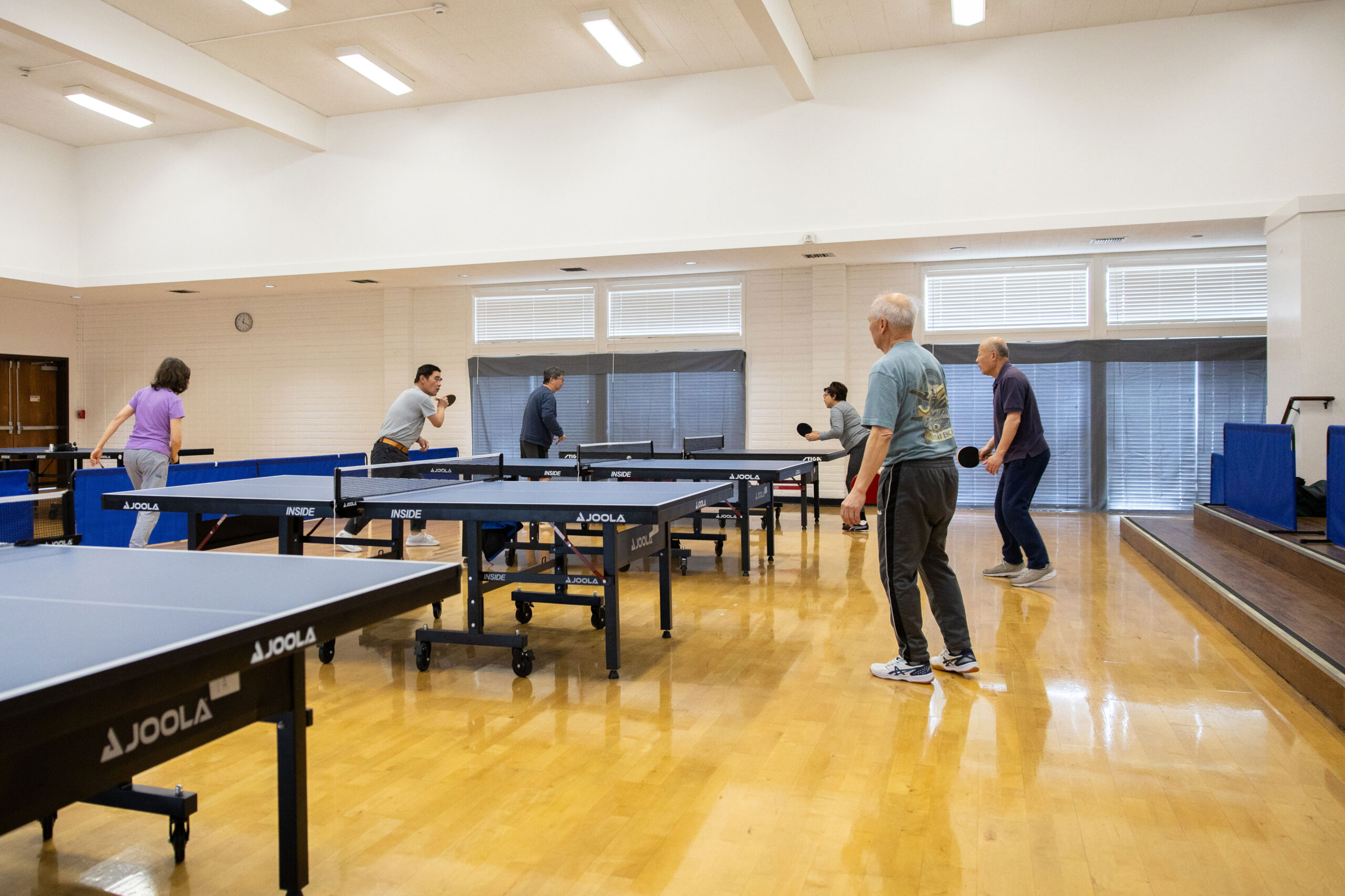 Adults playing table tennis