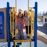 preschools outside on play equipment