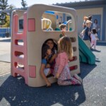 preschools outside on play equipment